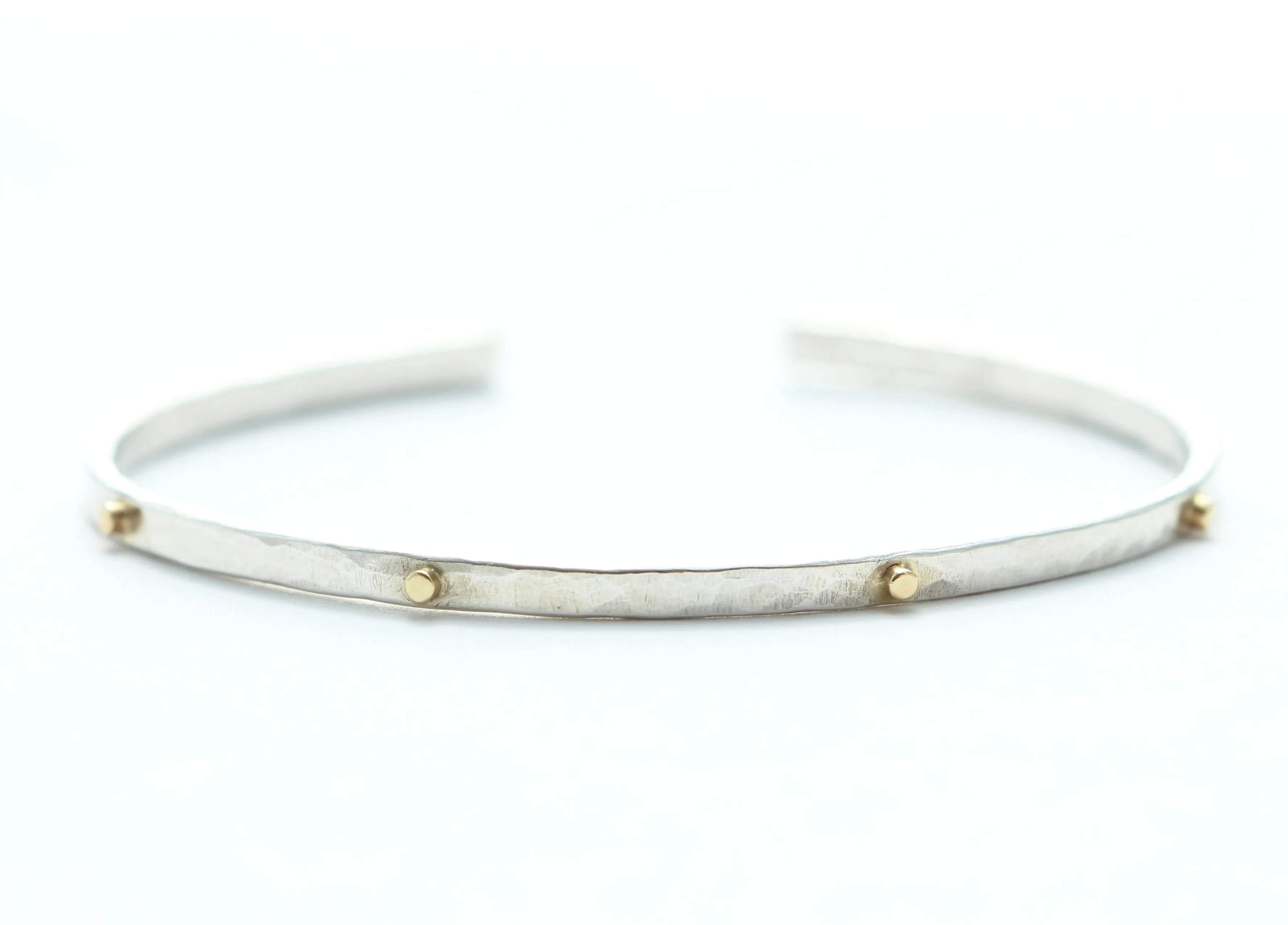 Thin hammered cuff bracelet with 8 gold wires
