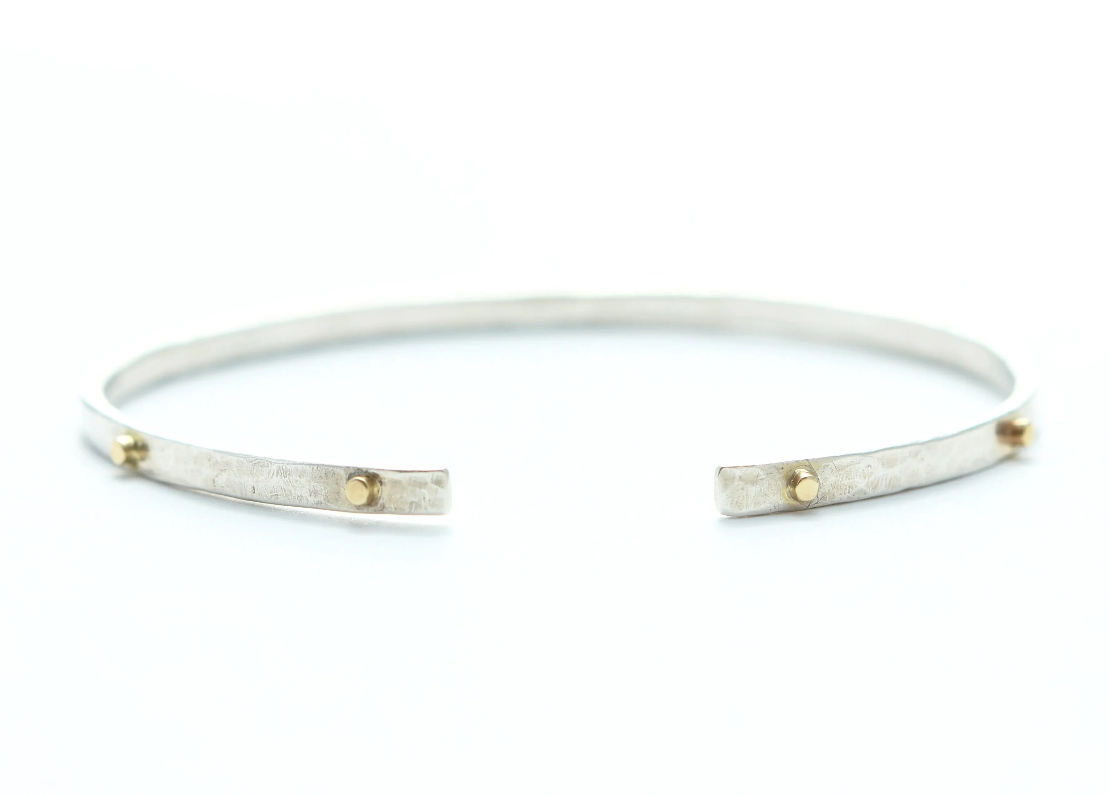 Thin hammered cuff bracelet with 8 gold wires